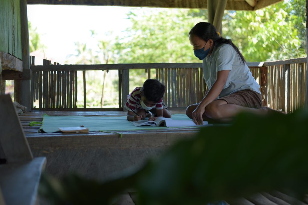 Ibu-Rosfina-accompanying-her-son-learning-from-home-min